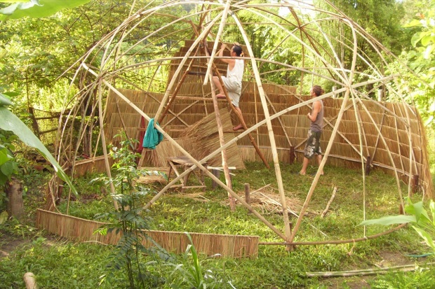 Past volunteers helping build a bamboo hut in Thailand